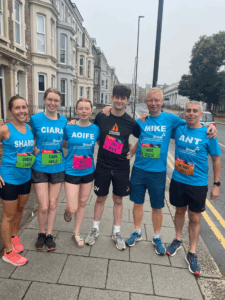 GNR_TEAM Our six Great North Run runners - three men and three women wearing their blue ABOAB t-shihrts and their arms around each other before the run in 2024